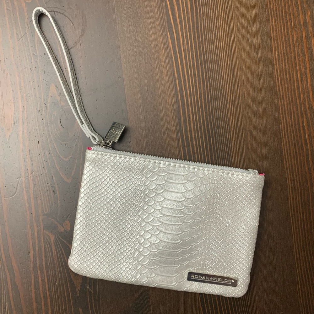 Rodan & Fields small silver makeup bag/wristlet